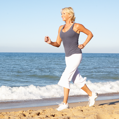 woman running on beach photo